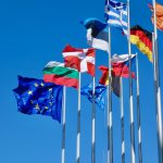 a bunch of flags that are flying in the air
