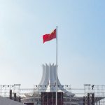 red white and blue flag on pole during daytime
