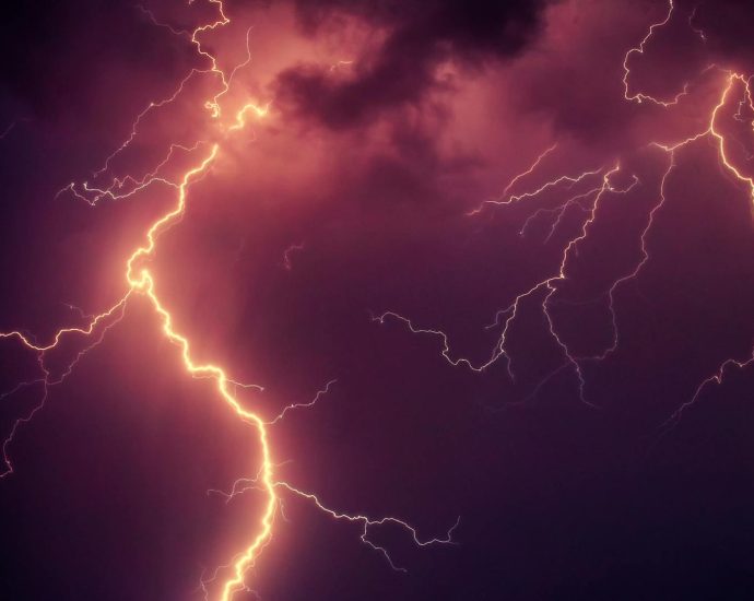 Stunning capture of bright lightning illuminating a dark stormy sky at night.