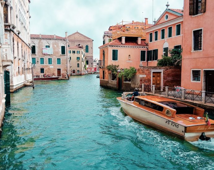 Picturesque view of Venice's canals with charming architecture and traditional boat.
