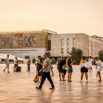 people walking on brown concrete floor during daytime