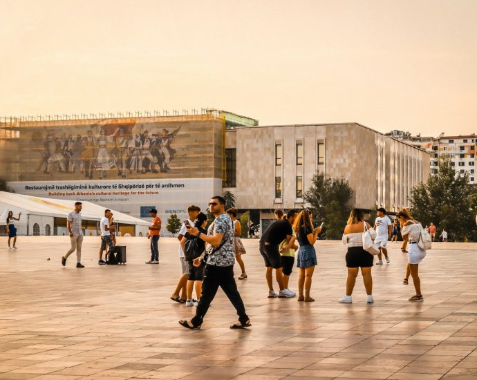 people walking on brown concrete floor during daytime