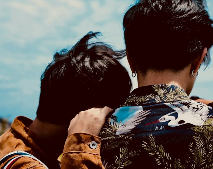 two boy's looking at sky
