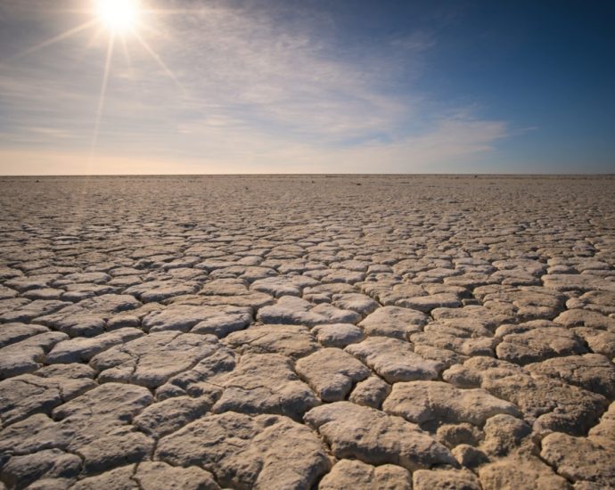 the sun is shining over a vast expanse of land