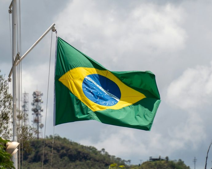 a green and yellow flag flying in the wind