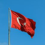 red and white national waving flag