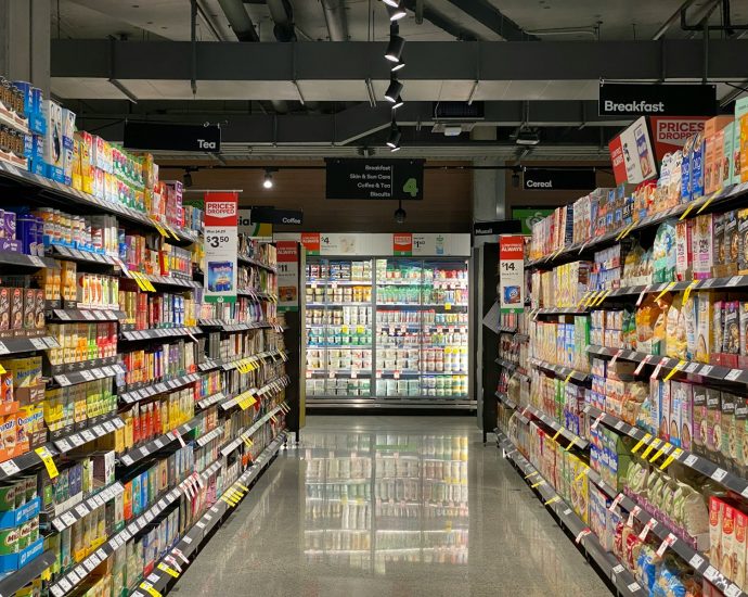 white and red labeled pack on white shelf