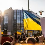 a group of people holding flags