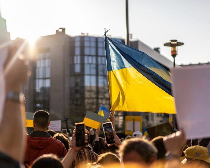 a group of people holding flags
