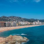 a beach with a lot of people on it