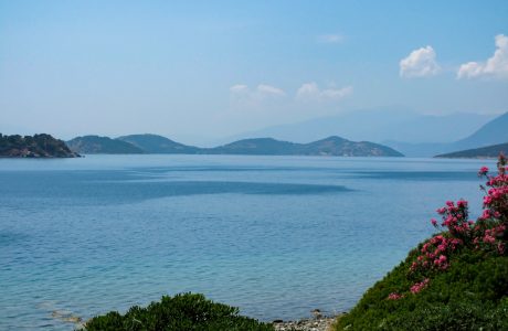 a body of water with hills in the background