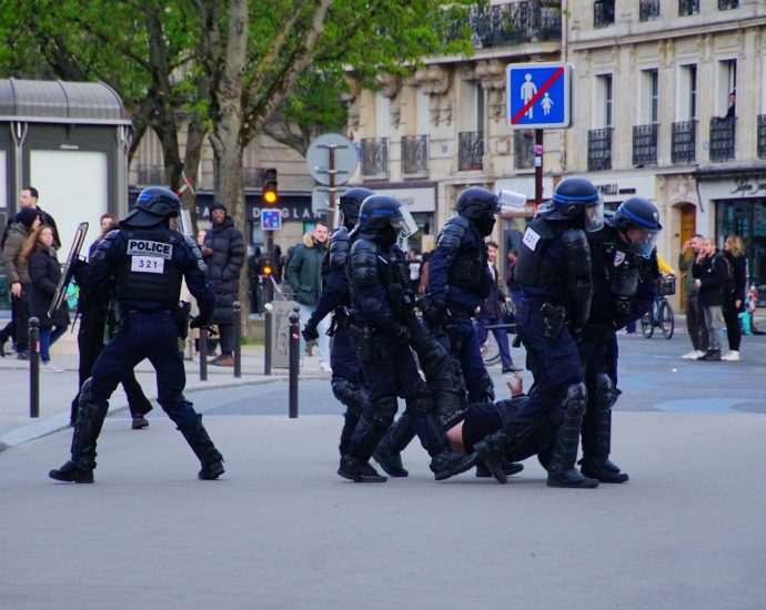 a group of police officers walking down a street