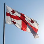 red and white flag on pole