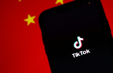 black smartphone showing time at 12 00