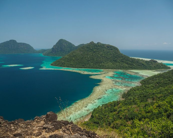 green sea surrounded with mountains