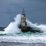 black and white tower on sea water