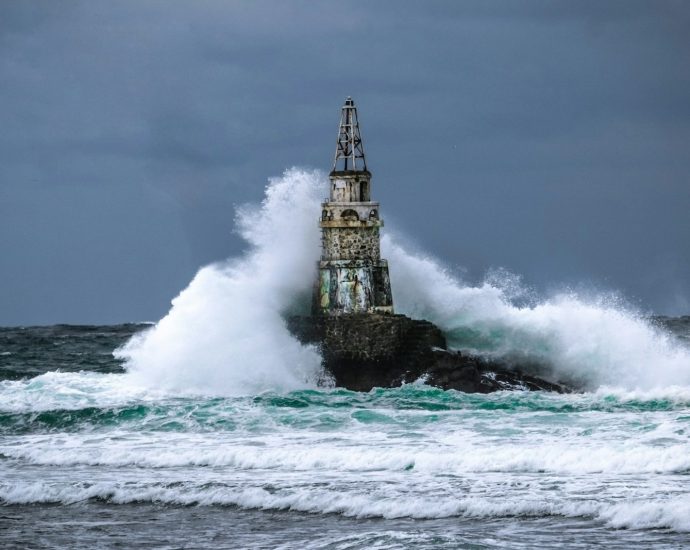 black and white tower on sea water