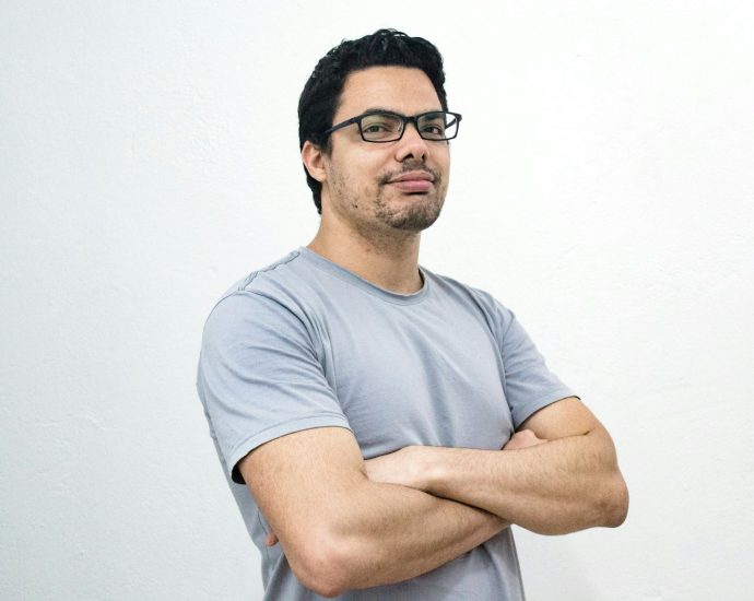 man crossing both arms