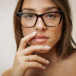 Woman wearing stylish tortoiseshell glasses