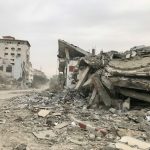 a large pile of rubble sitting on top of a street