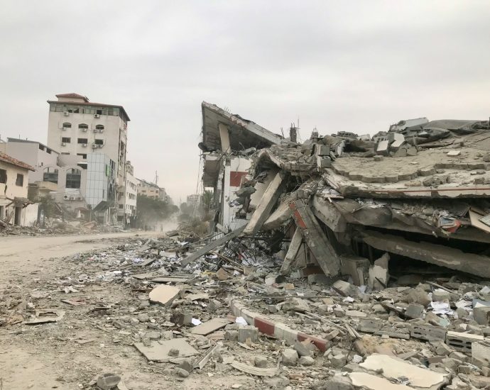 a large pile of rubble sitting on top of a street