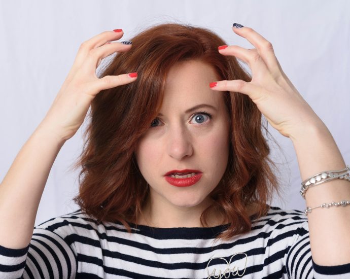 woman in black and white striped long sleeve shirt