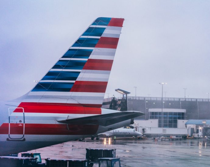 a large jetliner sitting on top of an airport tarmac