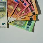 a bunch of money sitting on top of each other