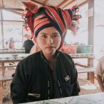 woman in black button up shirt sitting on chair