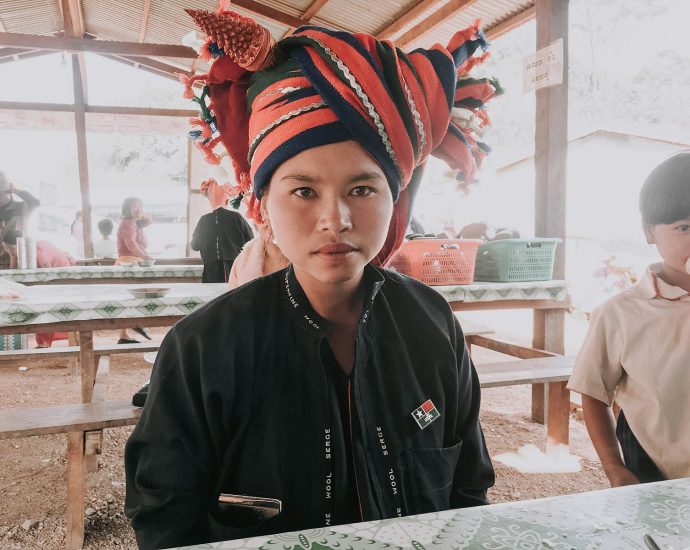 woman in black button up shirt sitting on chair