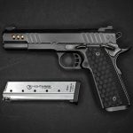 a gun and a knife on a black surface