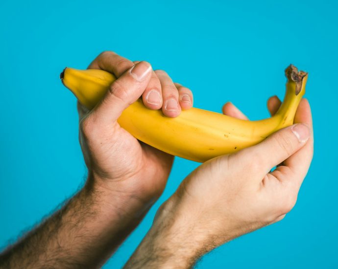 person holding banana