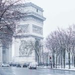 cars parked on sidewalk near building during daytime