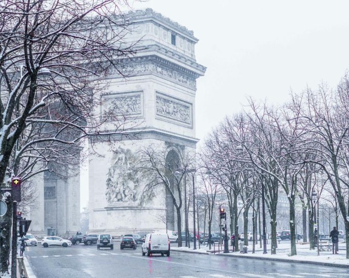 cars parked on sidewalk near building during daytime