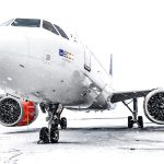 a large jetliner sitting on top of an airport tarmac
