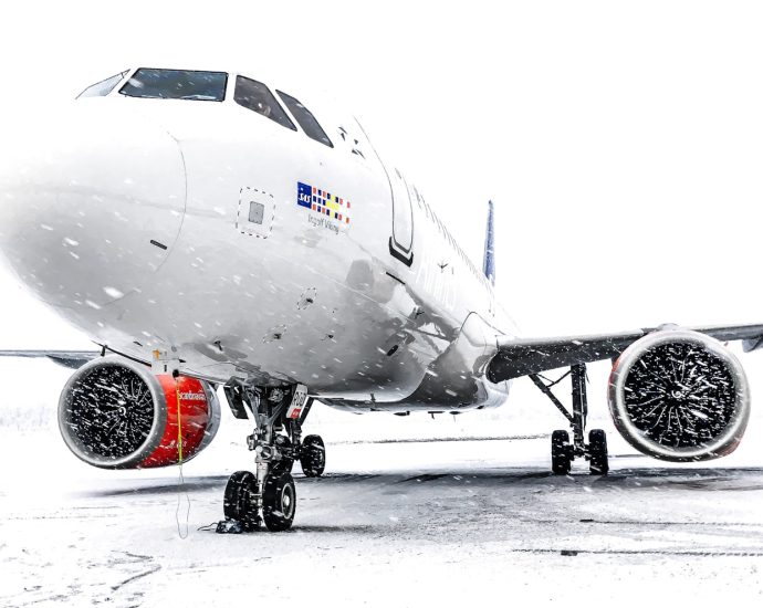 a large jetliner sitting on top of an airport tarmac