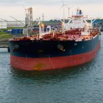 a large boat floating on top of a body of water
