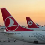 a couple of airplanes at an airport