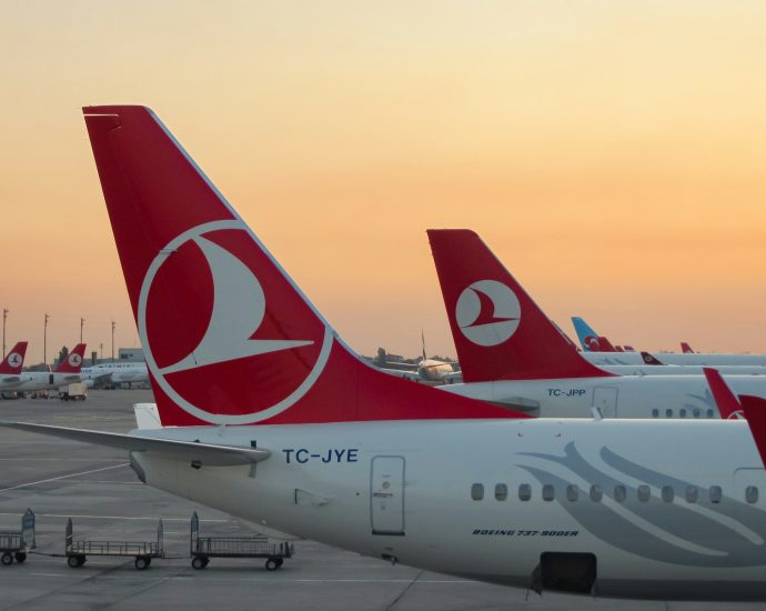 a couple of airplanes at an airport