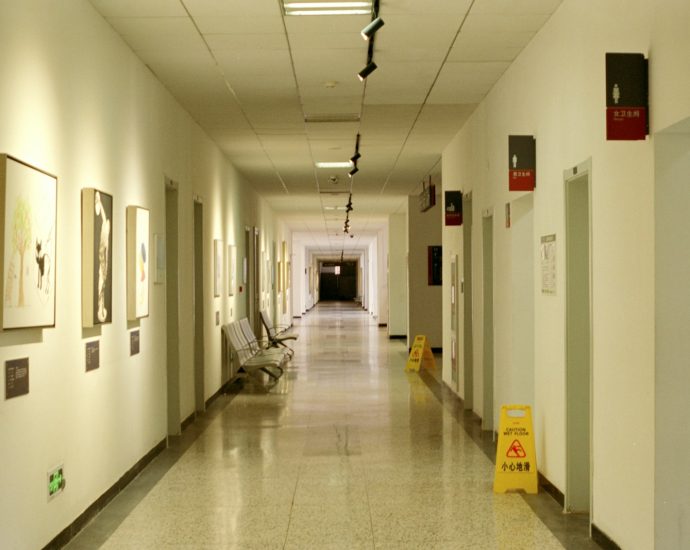 a long hallway with pictures on the walls
