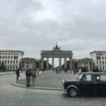 a black car parked in front of a building