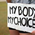 a person holding a sign