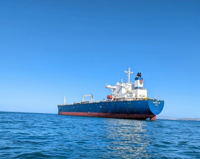 a large boat floating on top of a body of water