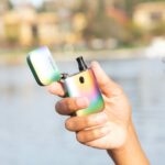 person holding green iphone 5 c