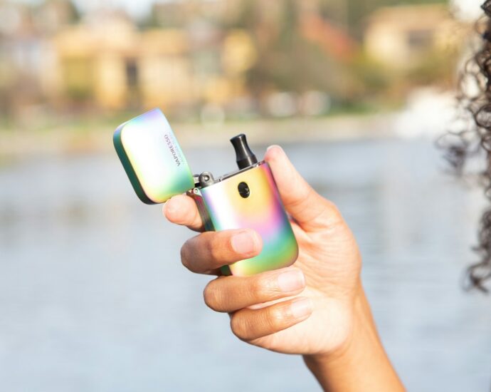 person holding green iphone 5 c