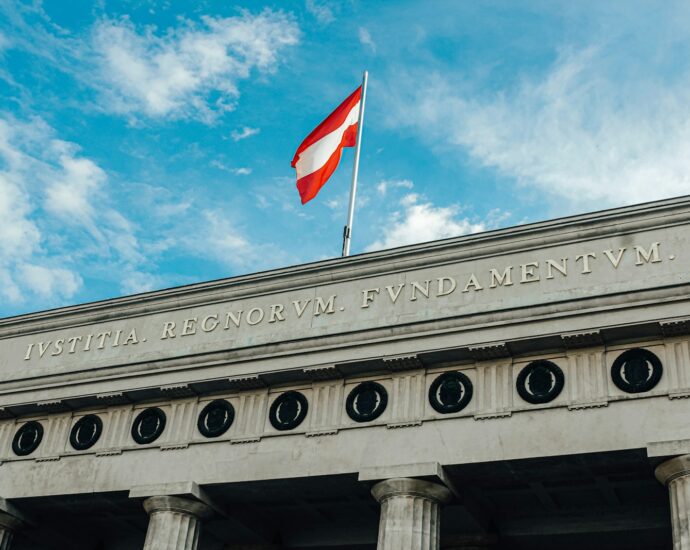 a flag is flying on top of a building