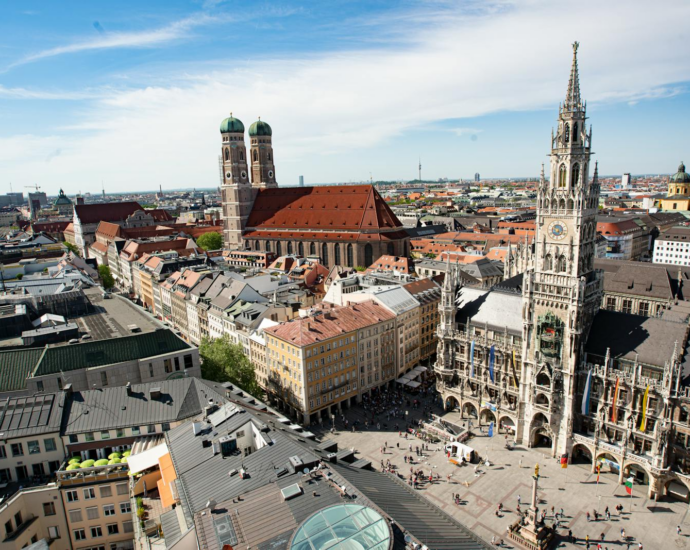 Majestic aerial view of Munich's Marienplatz and Frauenkirche showcasing historic architecture.