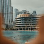 A blurry photo of a city with a pool