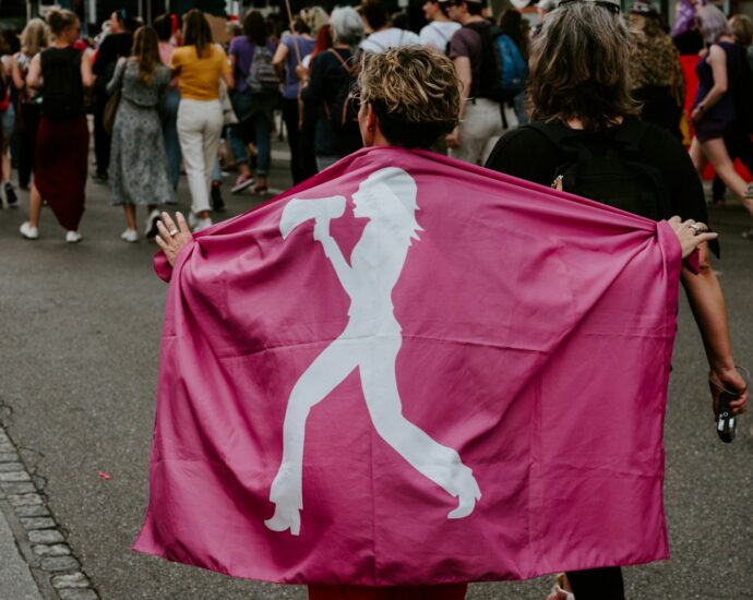 people gathering near road during daytime
