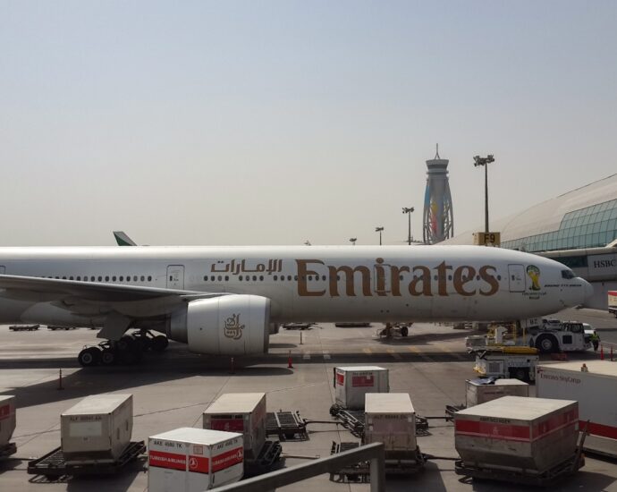 a large jetliner sitting on top of an airport tarmac